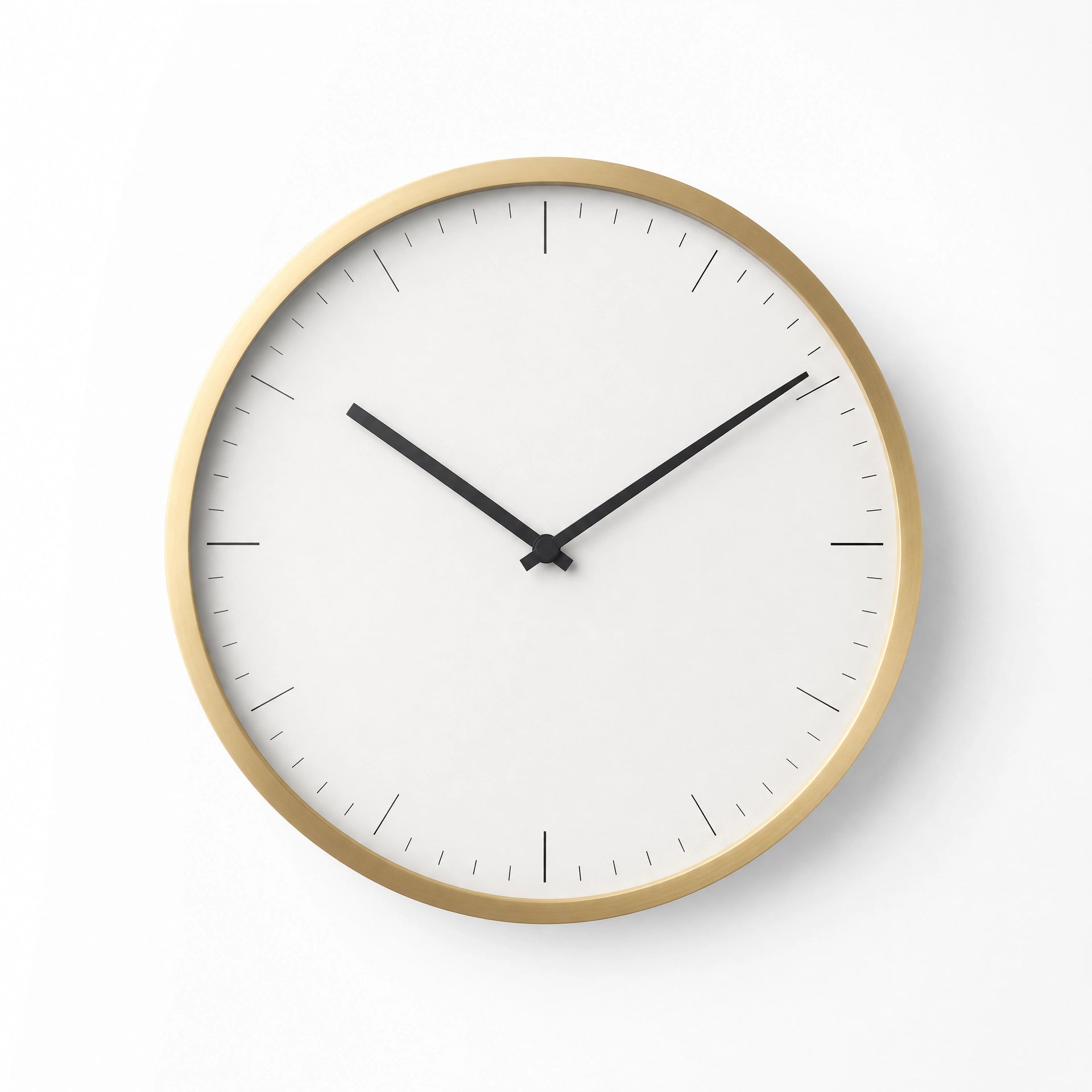 Minimalist gold wall clock on white wall